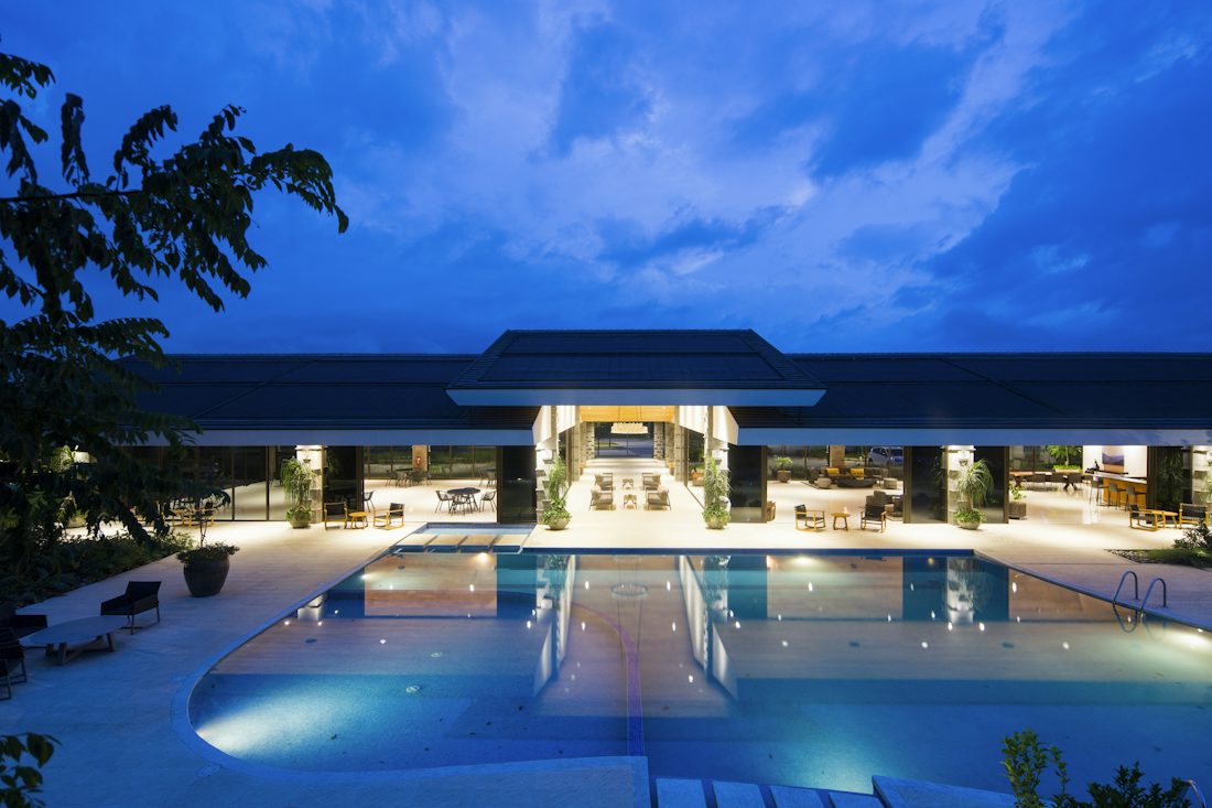 Luxury hotel exterior and pool at dusk