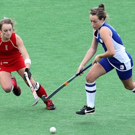 Two Woman competing For a Goal